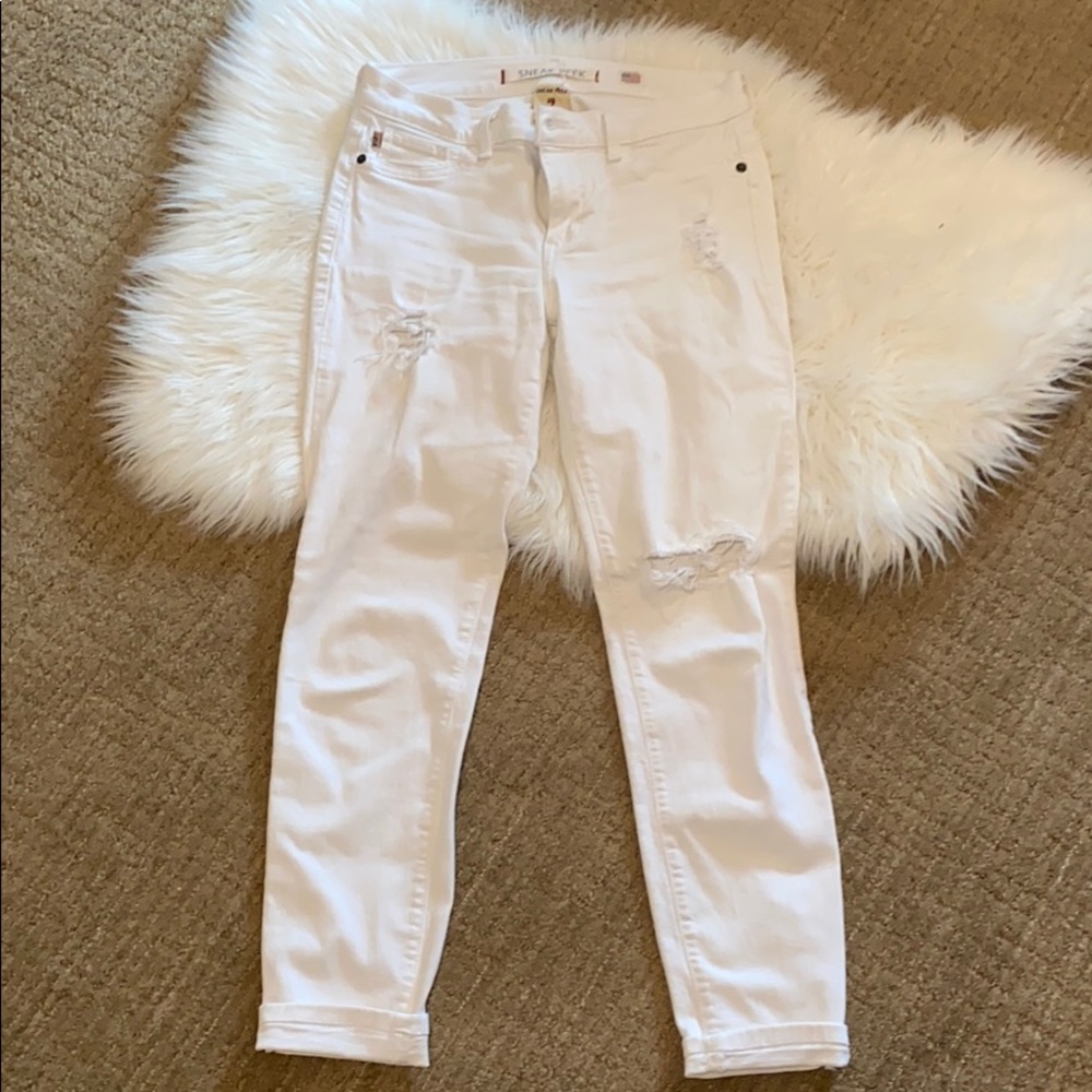 Distressed white jeans